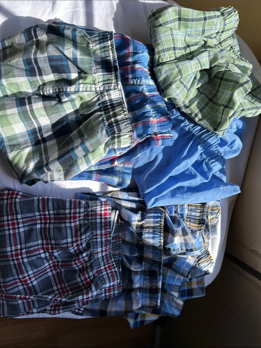 7 pairs men’s small plaid boxers. Washed but never worn.